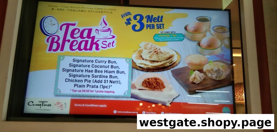 A vibrant display board showcasing Curry Times' Tea Break Set with various buns, prata, and drink options.