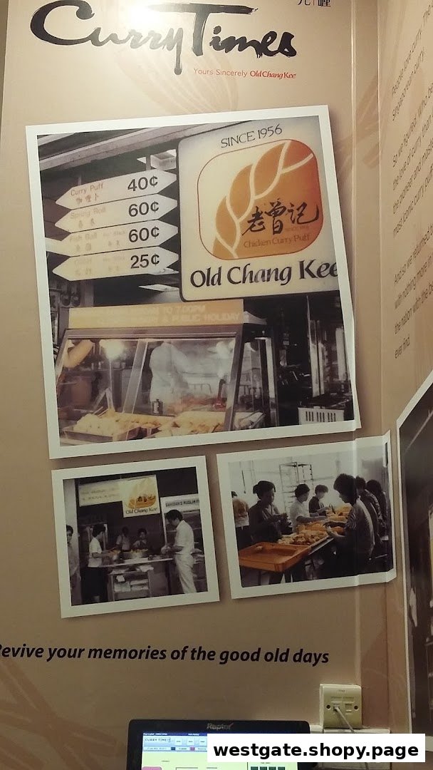 A wall display at Curry Times featuring vintage photos, Old Chang Kee branding, and a price list for traditional snacks.