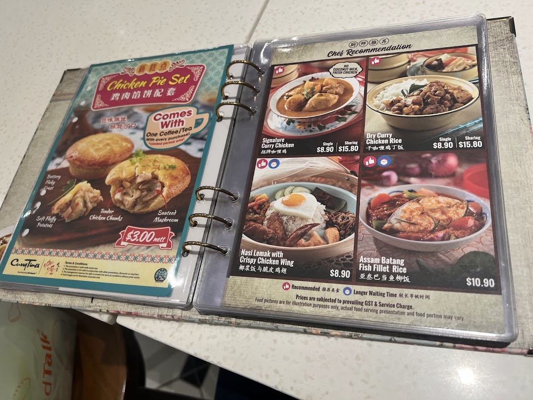 A detailed menu from Curry Times, showcasing chicken pies, curry dishes, and Nasi Lemak.