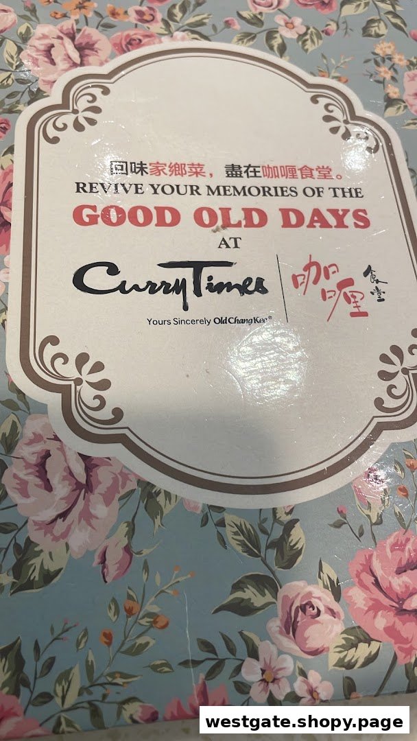 A floral-patterned sign for Curry Times, featuring its logo and 'Revive Your Memories of the Good Old Days' slogan.