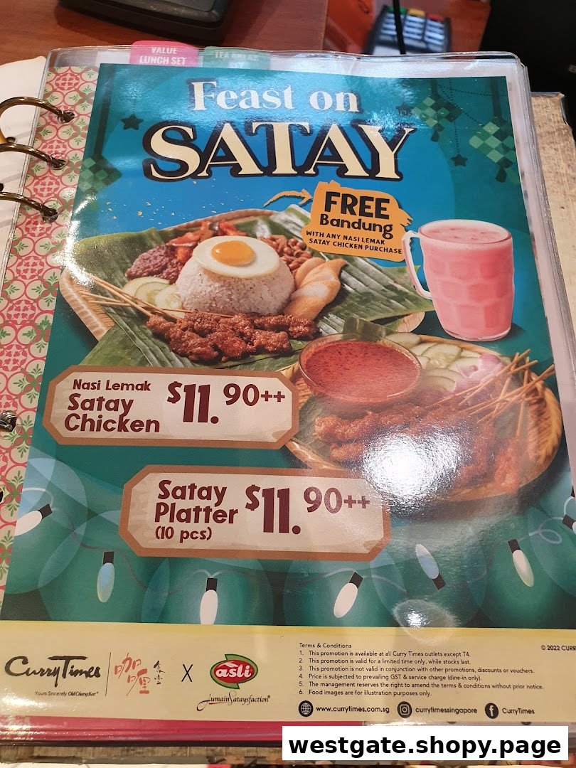 A menu page from Curry Times featuring satay dishes and a special Bandung drink offer.