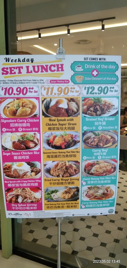 A vibrant menu board showcasing Curry Times' Weekday Set Lunch options with prices and dish images.