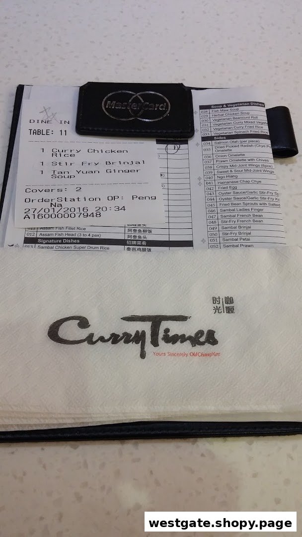 An order slip and branded napkin from Curry Times are displayed on a table.