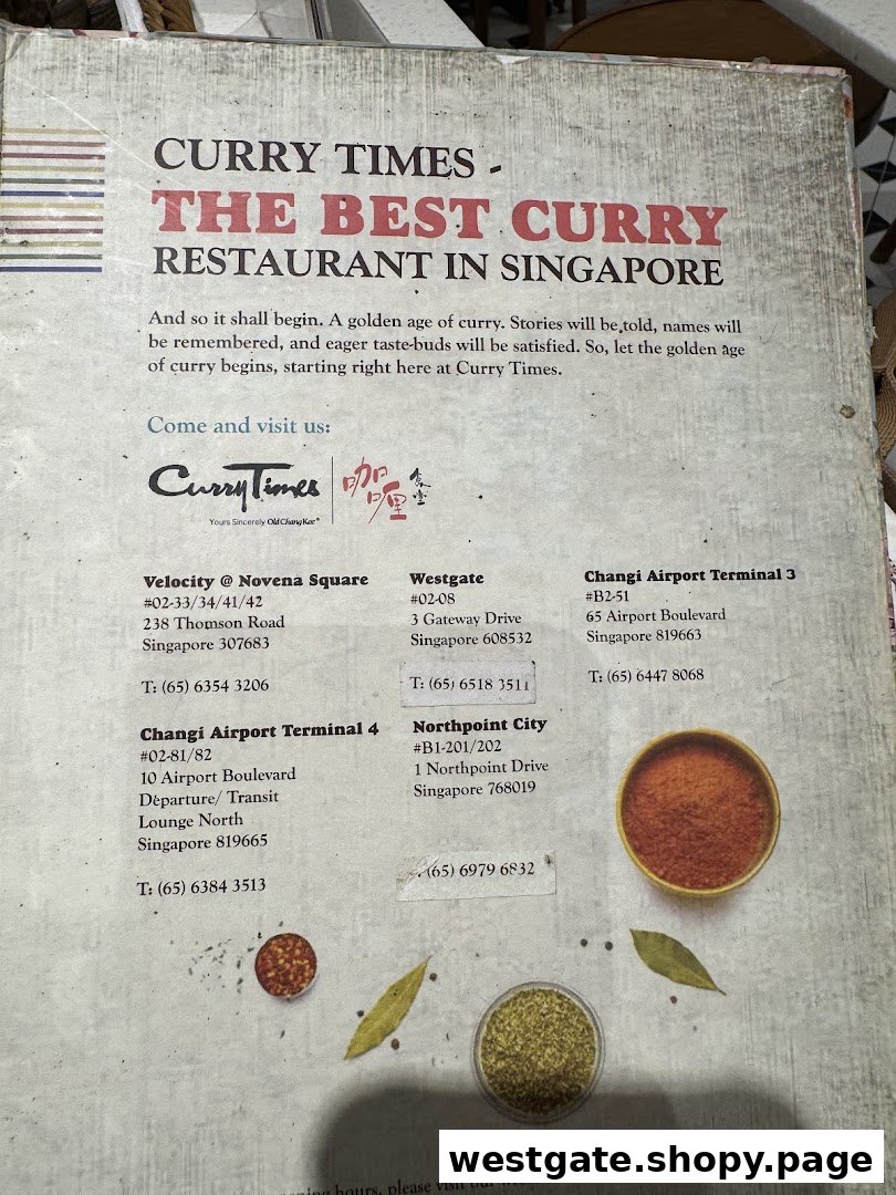 Information board for Curry Times, promoting it as 'The Best Curry Restaurant in Singapore' with branch details.