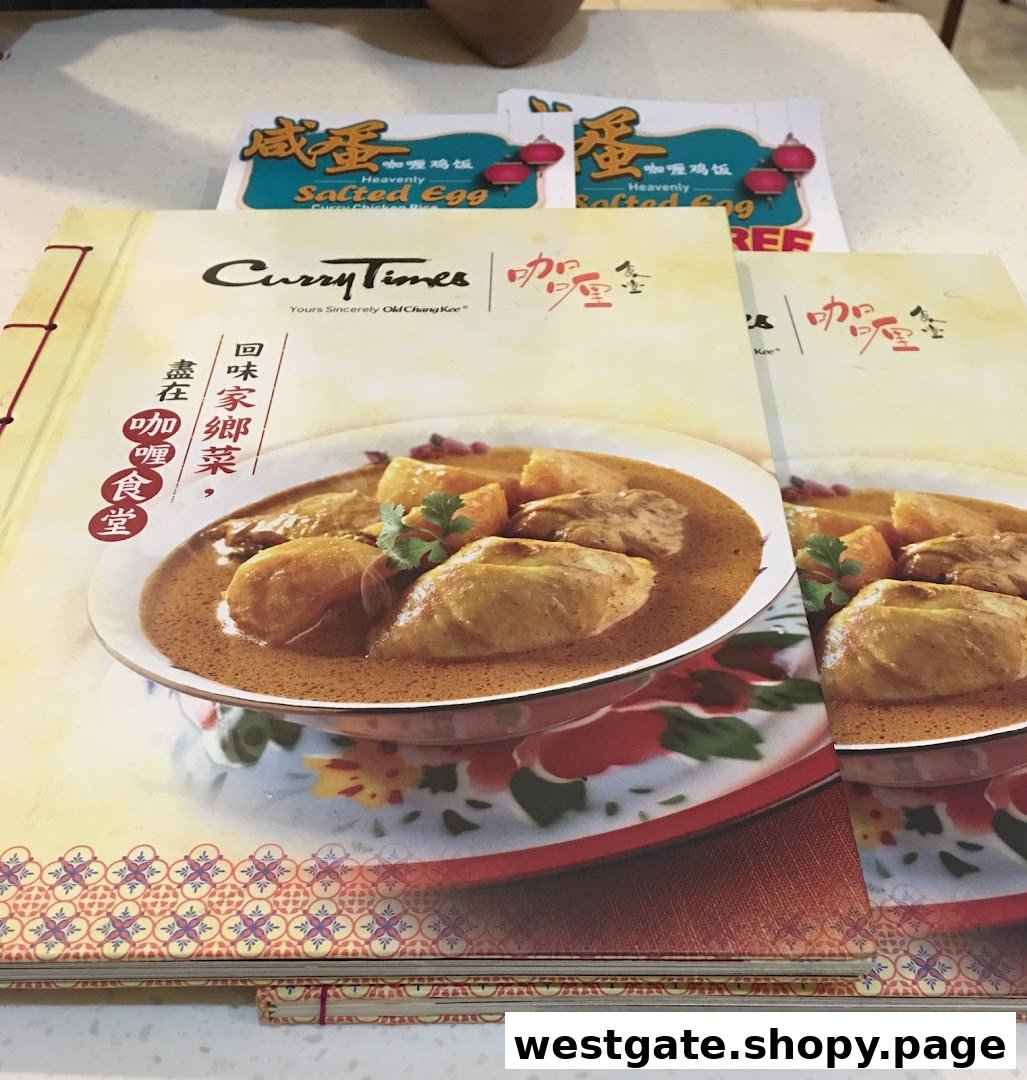 A Curry Times menu booklet cover featuring a delicious curry chicken dish and promotional flyers.