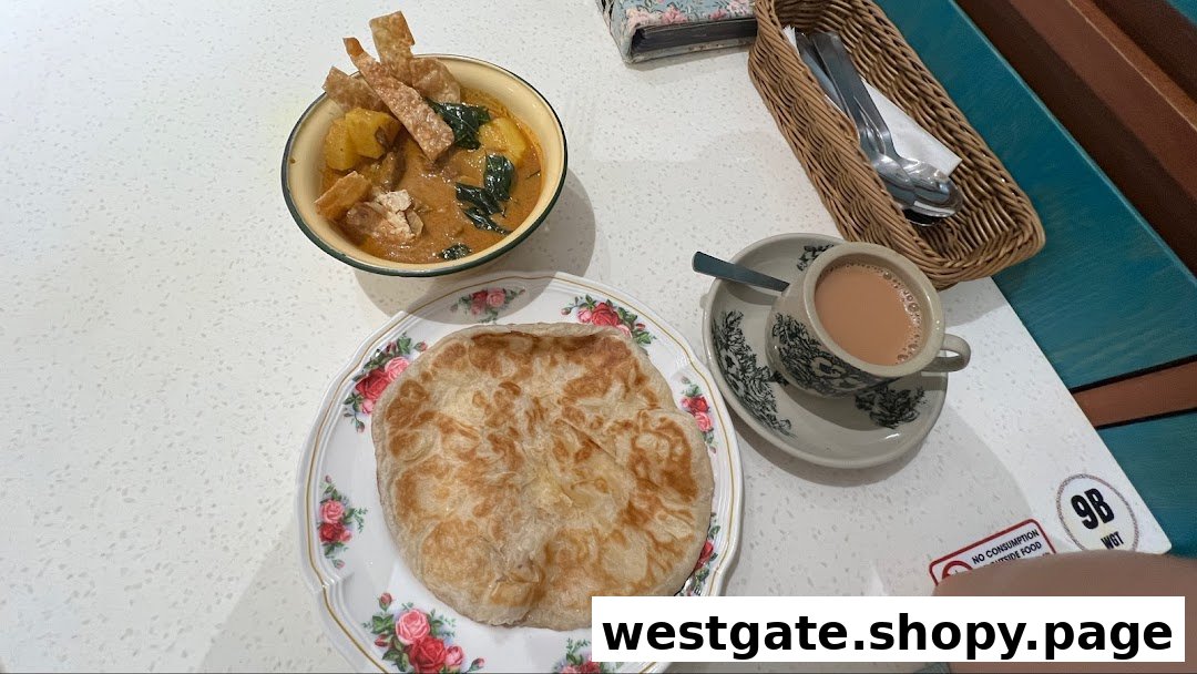 A delicious meal featuring curry, flatbread, and a cup of milk tea on a table at Curry Times.