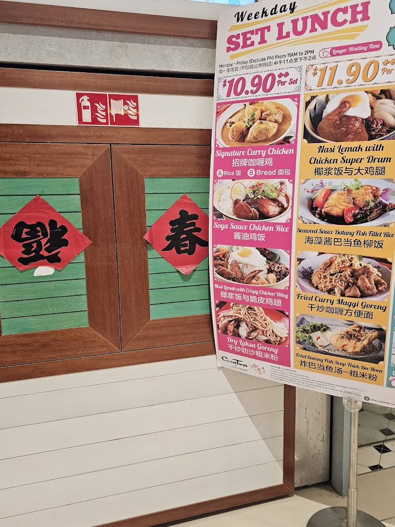 A menu board for Curry Times' Weekday Set Lunch, featuring various local dishes and prices.