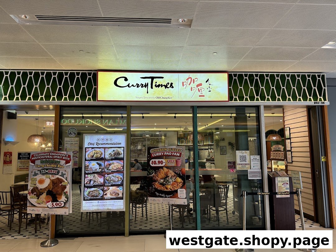 The storefront of Curry Times, featuring its signage, glass entrance, and promotional posters.