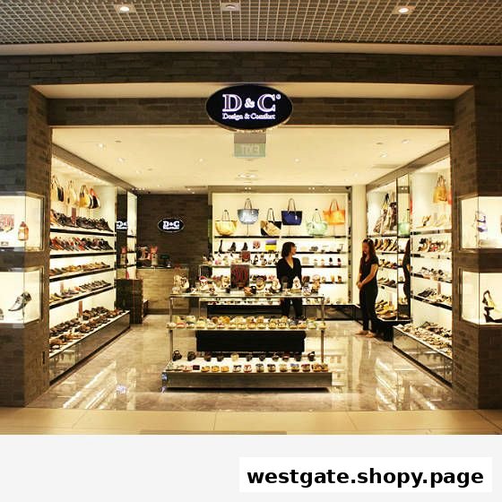 The shop front of 'DC - Design & Comfort' showcasing a wide array of shoes and handbags.