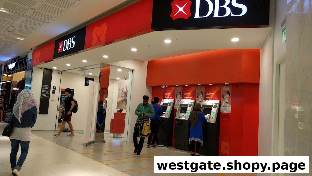 The entrance and ATM area of a DBS Bank branch with customers using services.