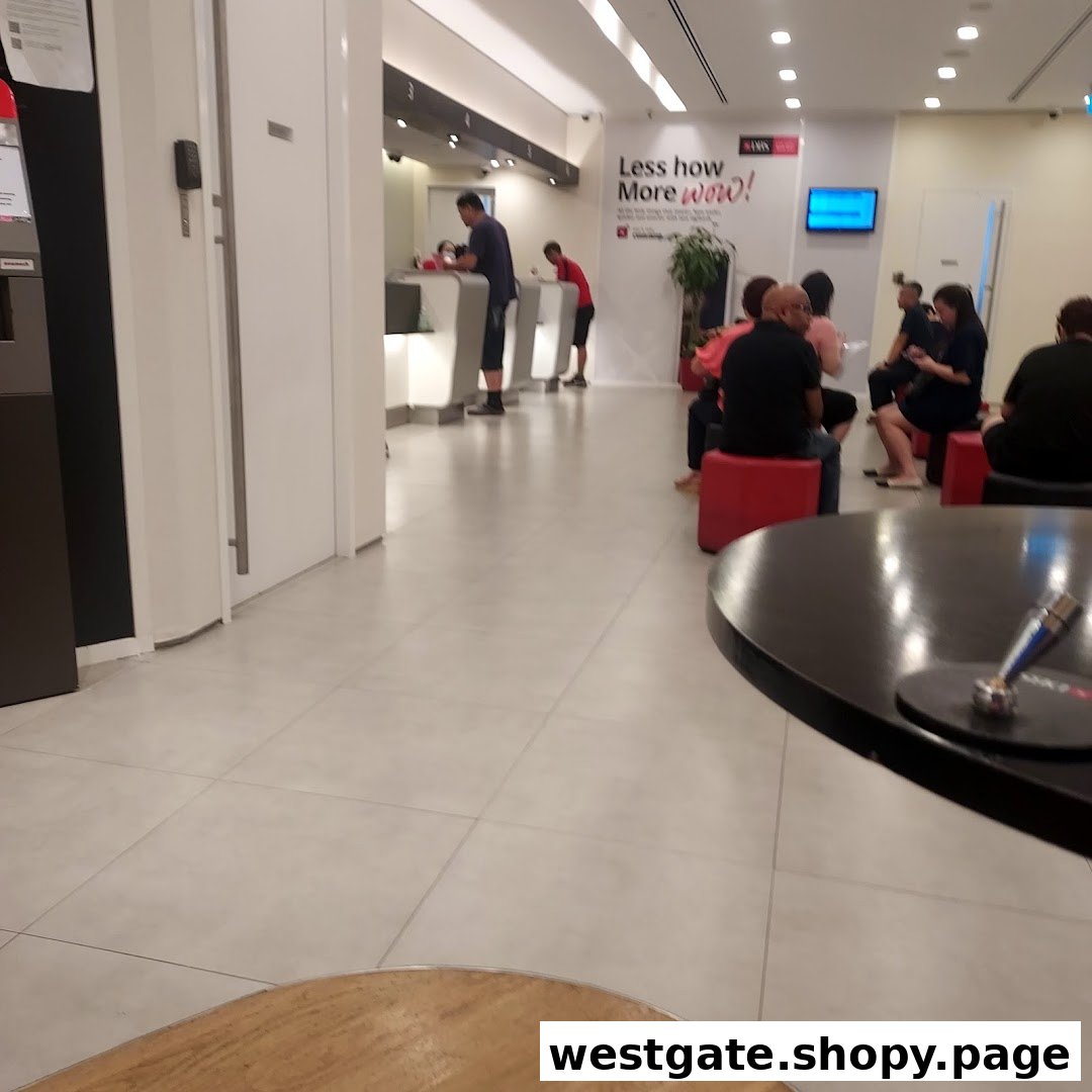 Interior view of DBS Westgate Branch showing customers waiting and staff assisting at counters.