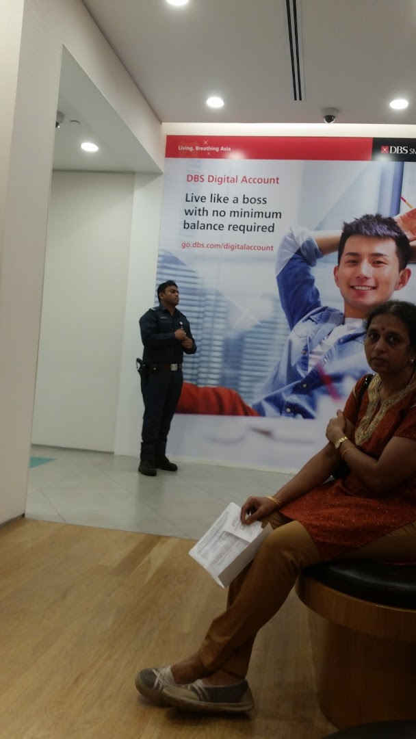 Interior view of DBS Westgate Branch with a security guard and customer.