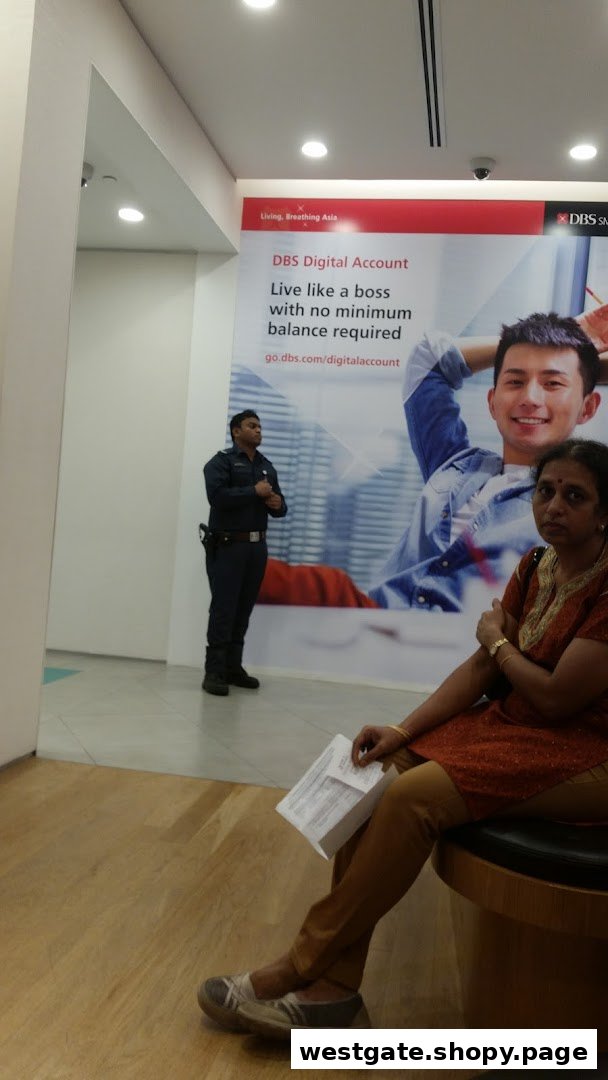 Interior view of DBS Westgate Branch with a security guard and customer.