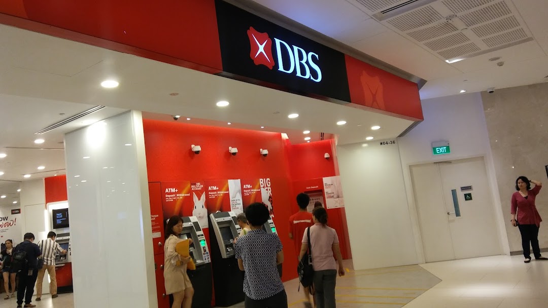 The entrance of DBS Bank Westgate Branch featuring multiple ATMs and customers.