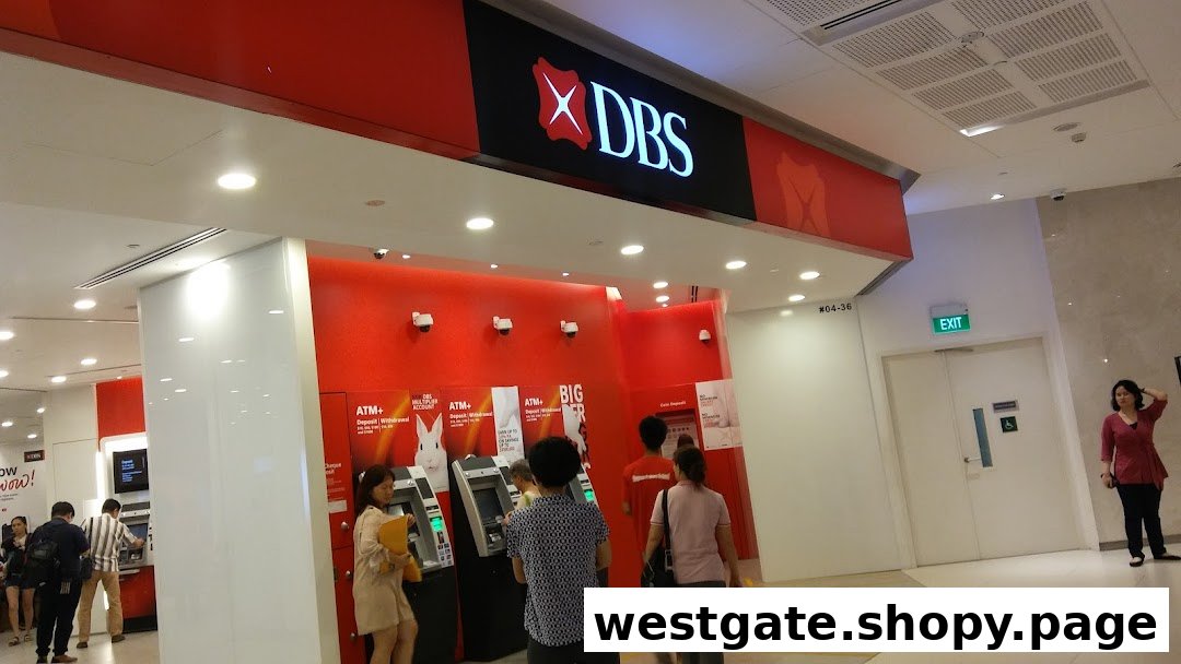 The entrance of DBS Bank Westgate Branch featuring multiple ATMs and customers.