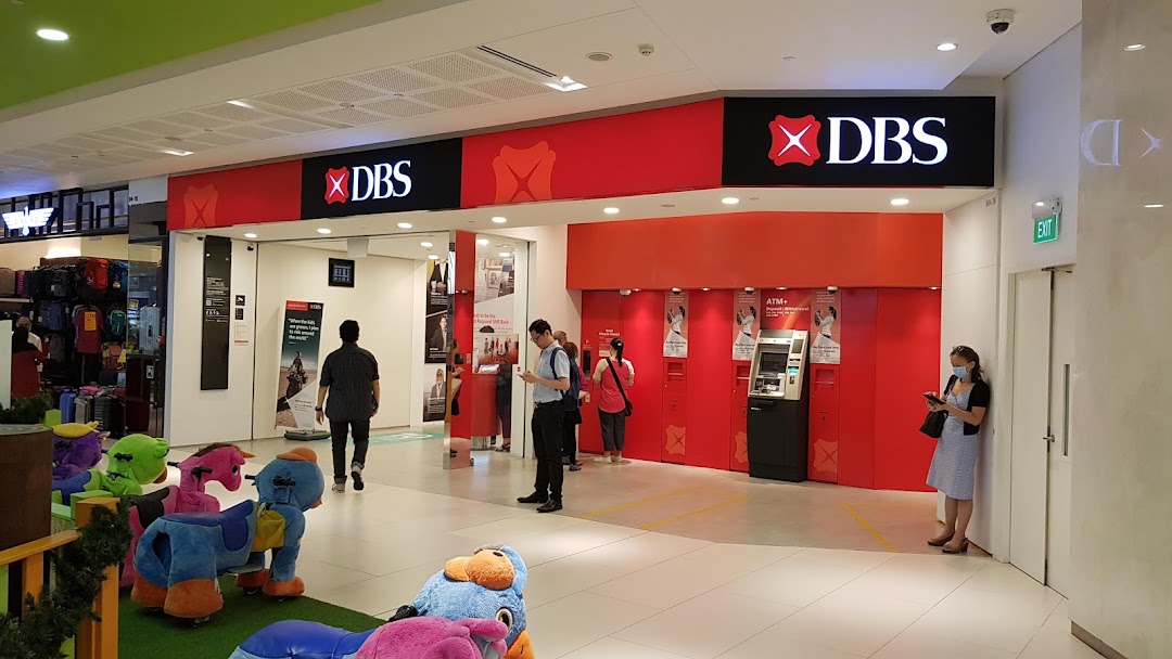 The entrance of DBS Bank Westgate Branch with ATMs and customers inside a shopping mall.