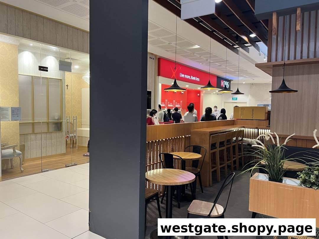 Interior view of a shopping mall featuring the DBS bank branch and adjacent seating area.