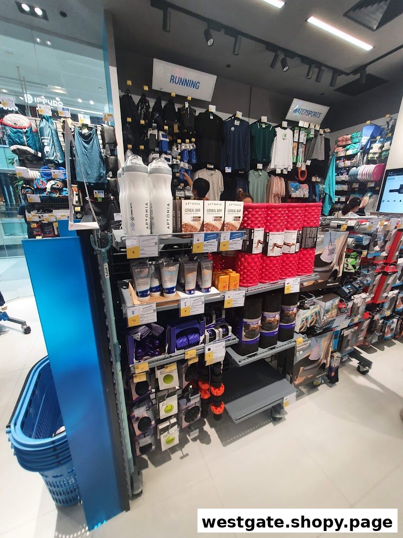 An interior view of Decathlon, showcasing running and watersports apparel and equipment on display.