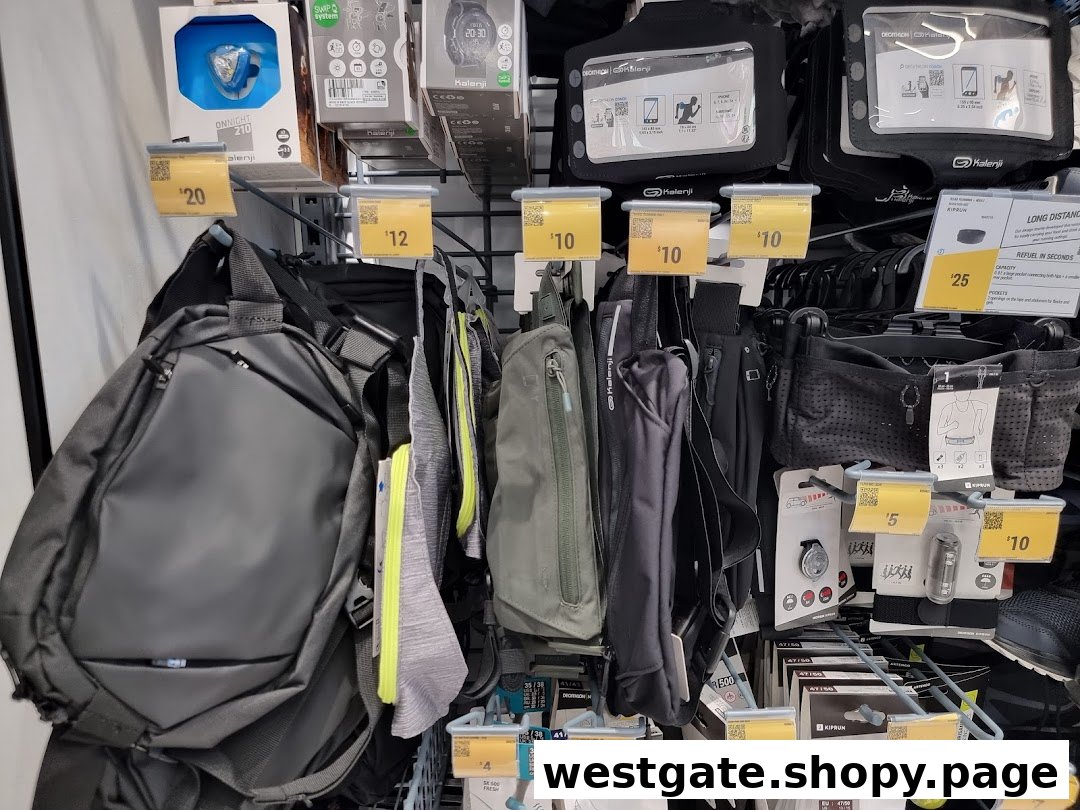 A close-up view of various sports accessories, including bags, phone holders, and lights, displayed with price tags.