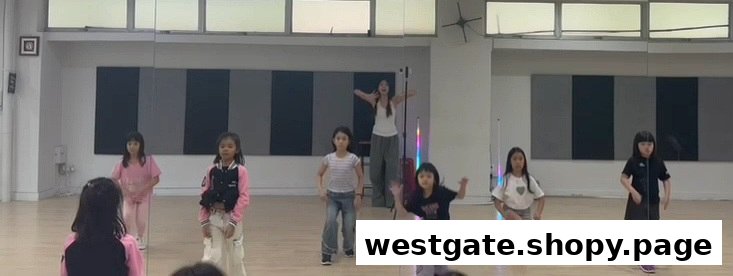 Children actively participating in a dance class with an instructor at DF Academy.