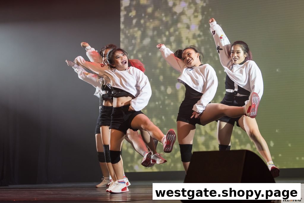 A group of young dancers performing on stage with dynamic poses and energetic expressions.