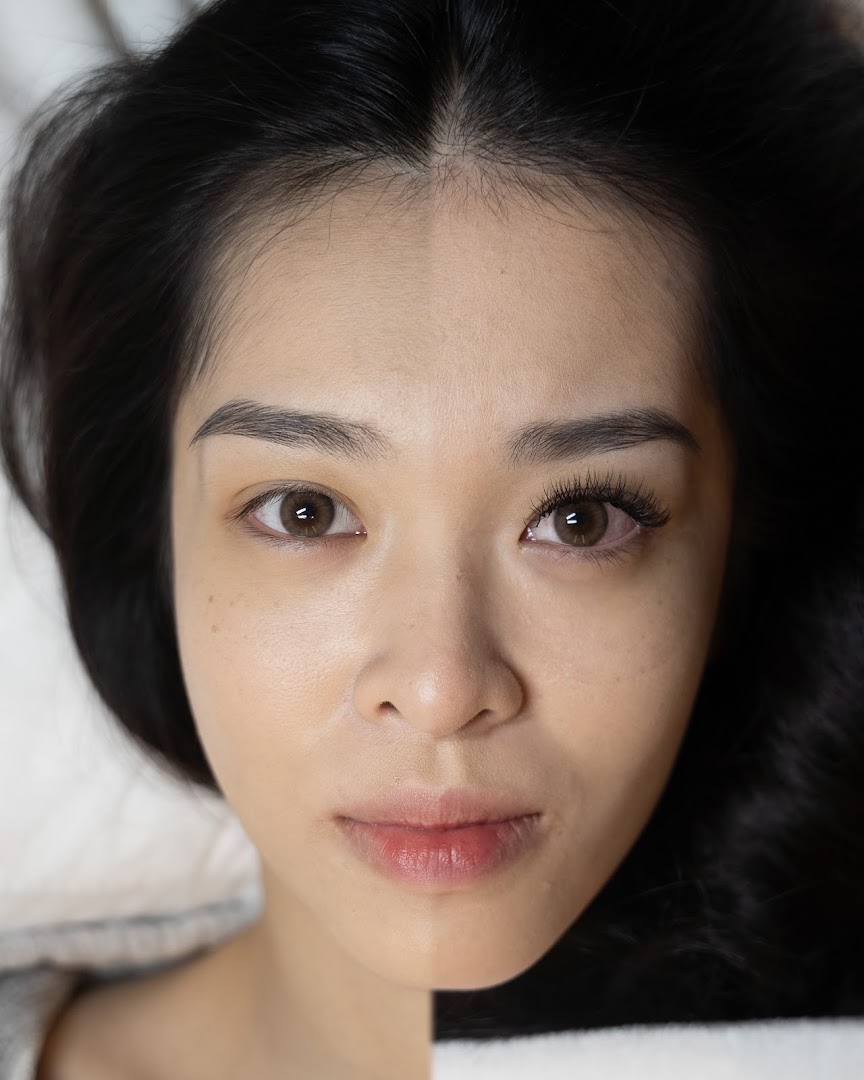 Close-up of a woman's face showing a before-and-after comparison of lash extensions.