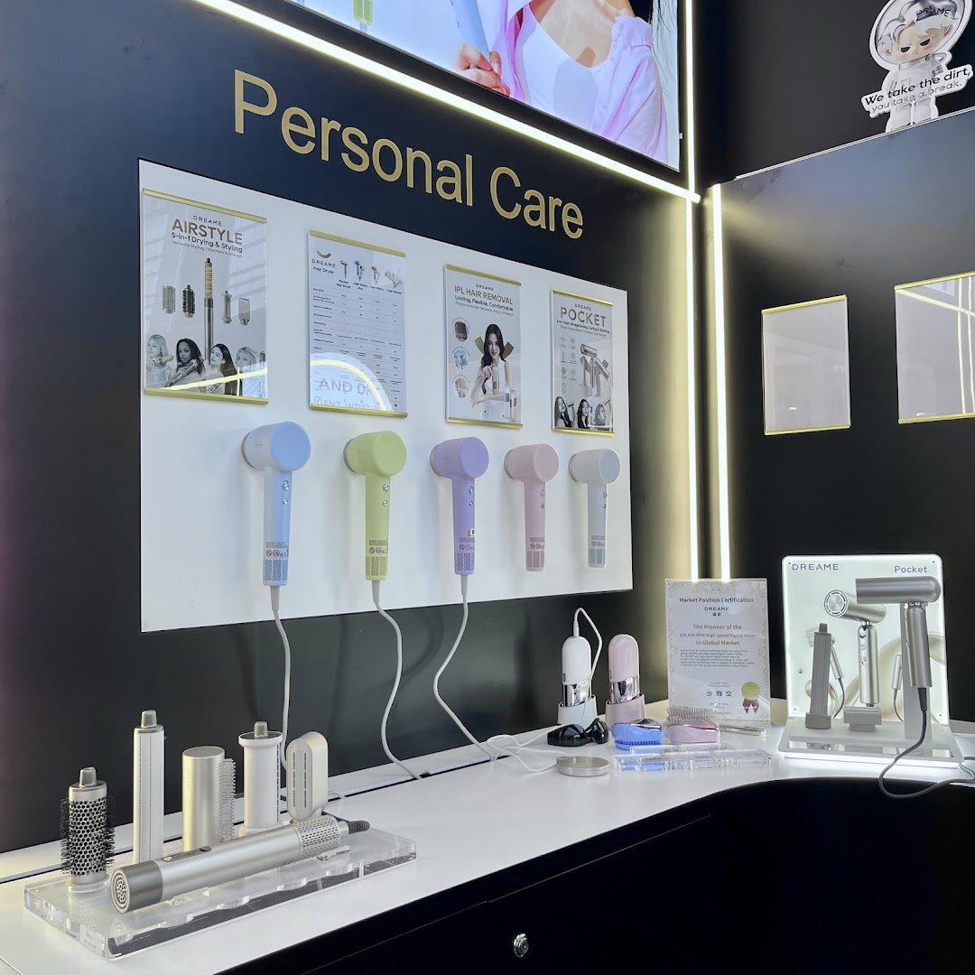 A vibrant display of Dreame personal care devices, including hair dryers and styling tools, with product information.