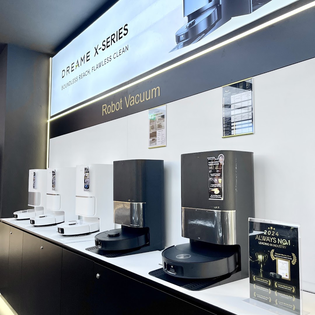 A modern display of Dreame X-Series robot vacuums in a retail store.
