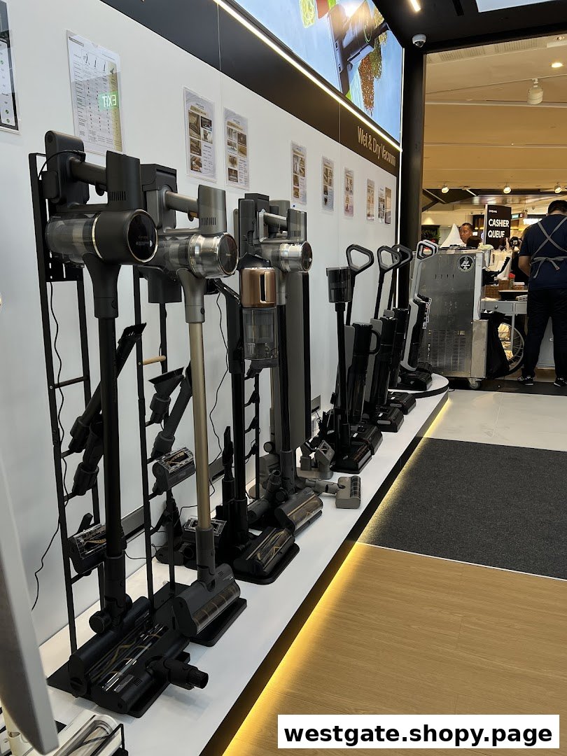 A display of various Dreame vacuum cleaners and cleaning appliances in a retail store.