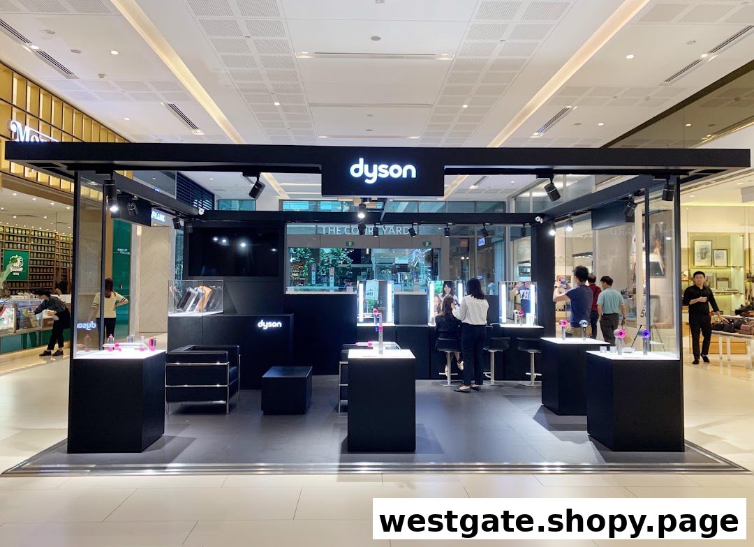 A modern Dyson pop-up store in a mall, showcasing innovative products with interactive displays.