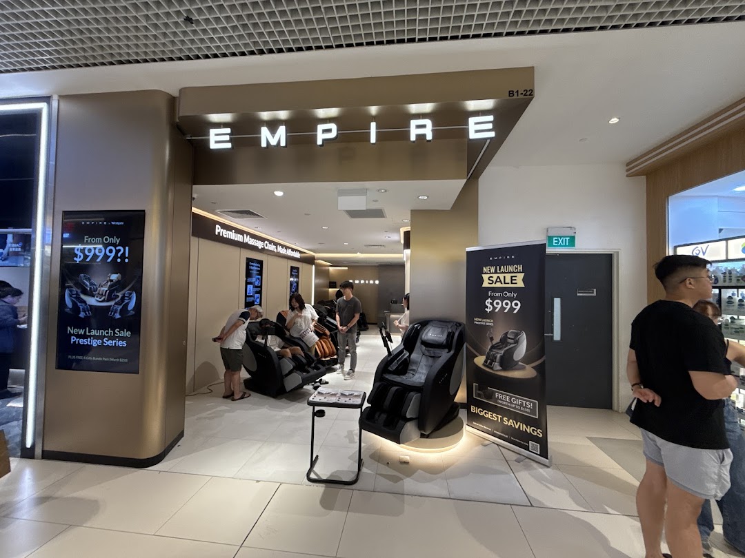 The entrance of EMPIRE Massage Chair store, showcasing massage chairs and customers trying them.