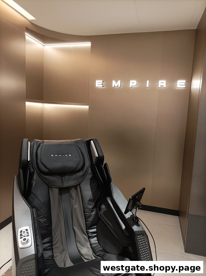 A luxurious black massage chair displayed inside the EMPIRE store, featuring modern design and ambient lighting.