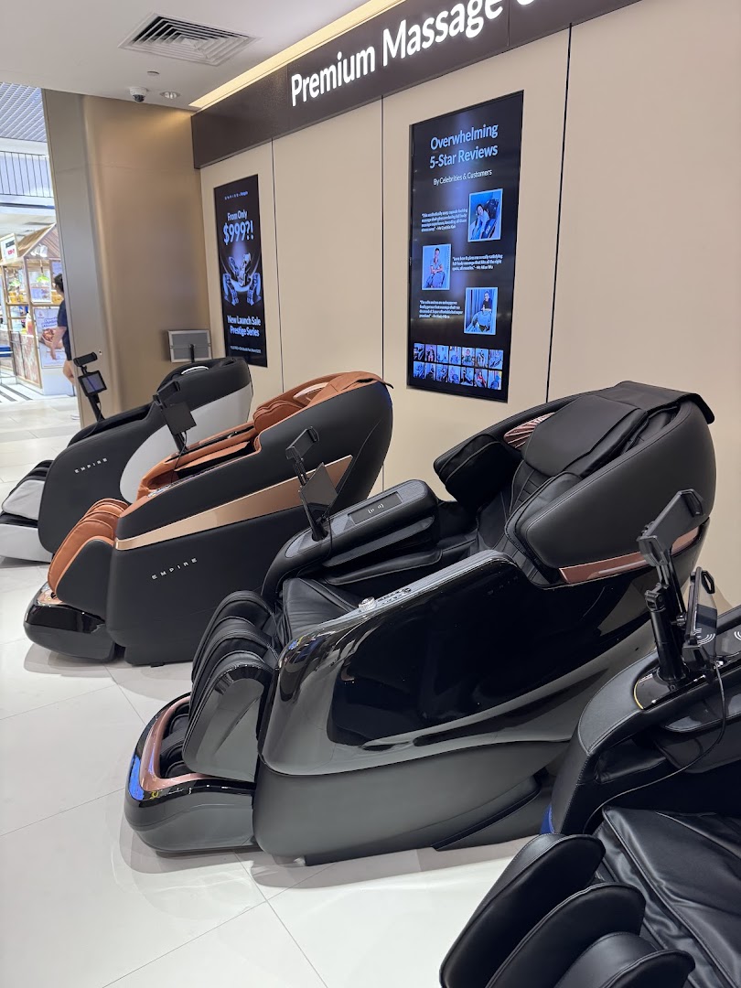 A showroom displaying several premium massage chairs from EMPIRE, featuring sleek designs.