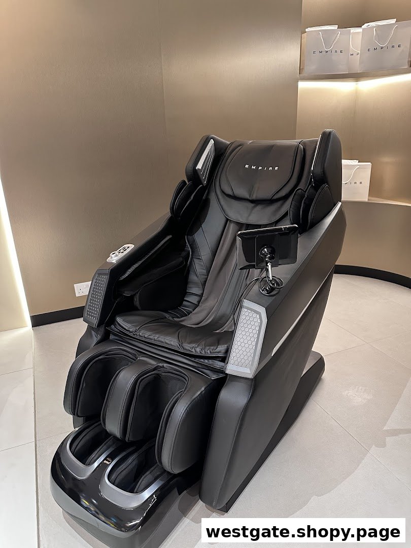 A sleek black EMPIRE massage chair is displayed in a modern retail setting.