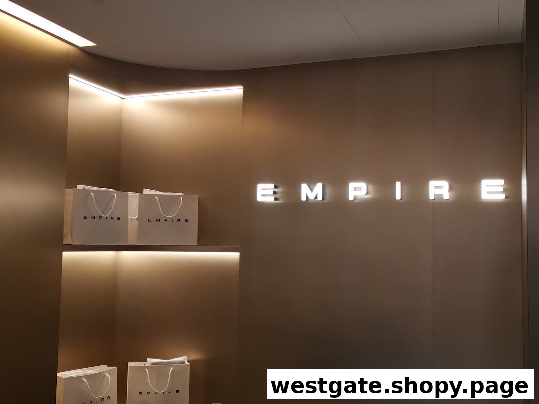 Interior shot of EMPIRE store featuring illuminated branding and display shelves with branded bags.