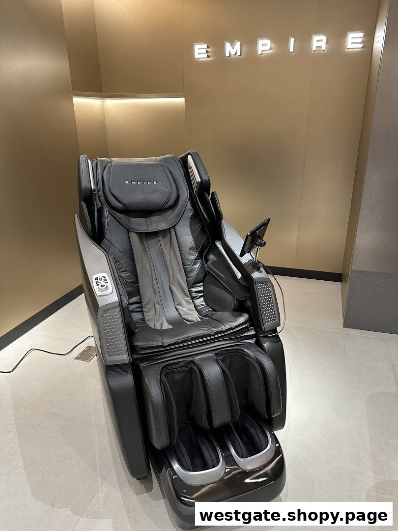 A sleek black Empire massage chair displayed in a modern retail setting.