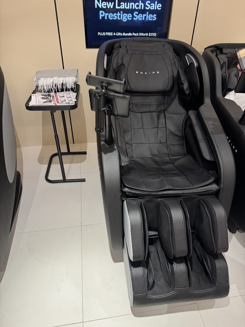 A luxurious black massage chair from the Prestige Series displayed in the Empire showroom.