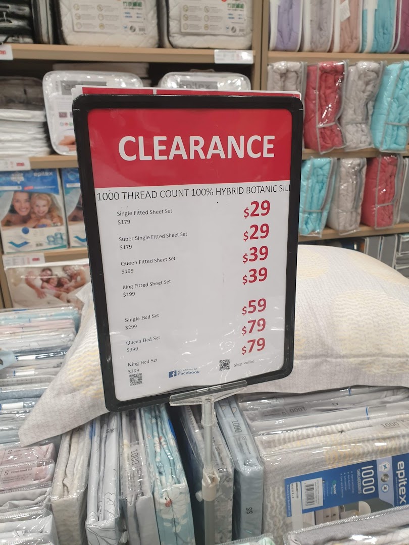 A clearance sale sign for 1000 thread count hybrid botanic silk bedding at Epitex.
