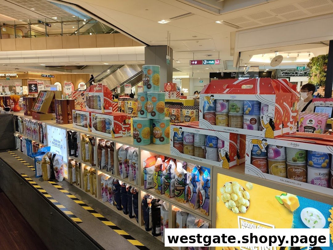 A vibrant display of Eureka Popcorn products and gift sets inside a bustling shopping mall.