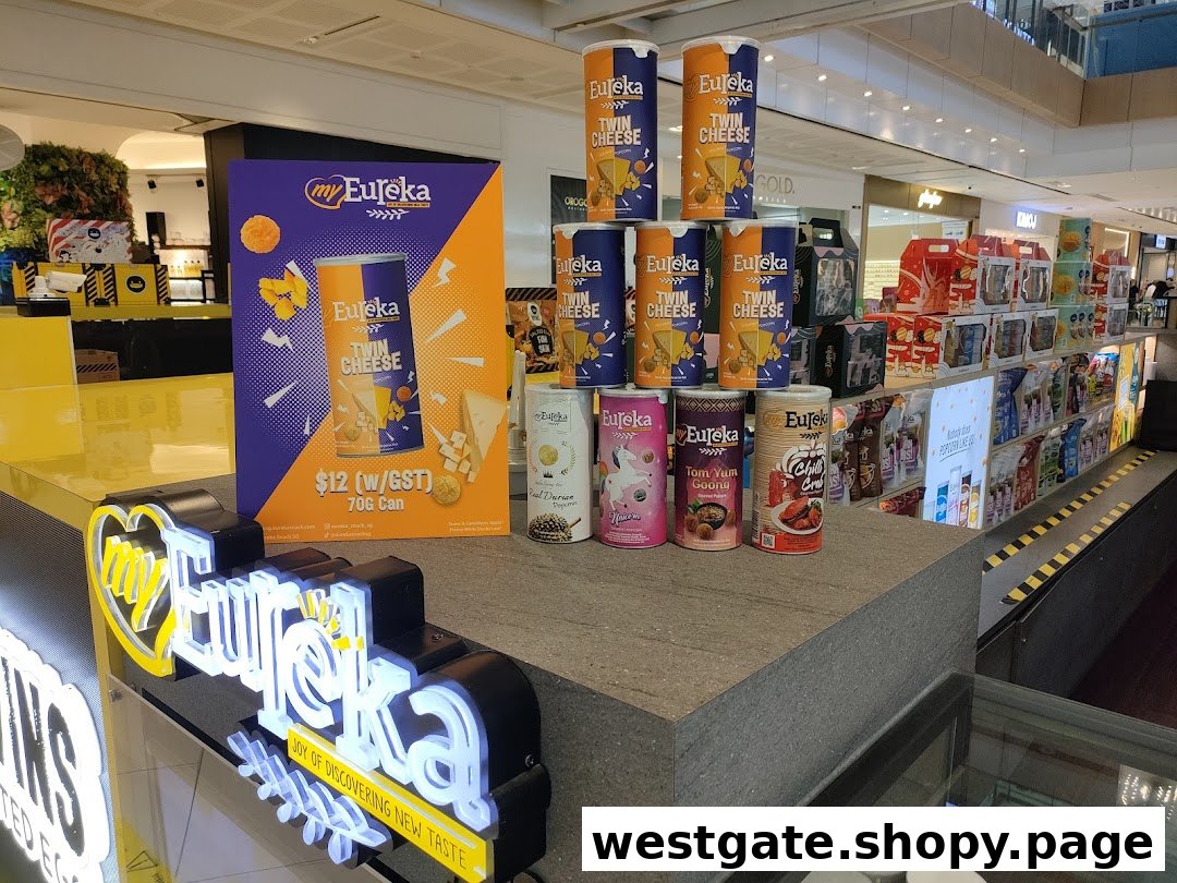 A vibrant display of Eureka popcorn products, featuring various flavors and a promotional stand for Twin Cheese.