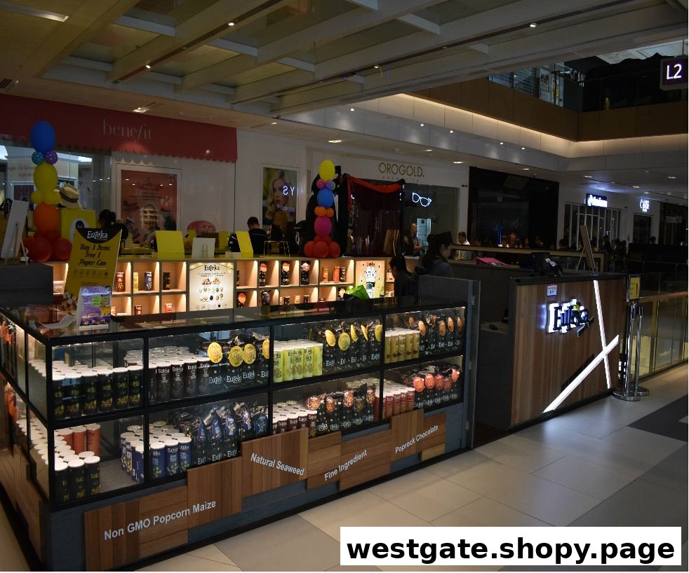 Eureka Popcorn kiosk in a mall, showcasing a variety of gourmet popcorn products and flavors.
