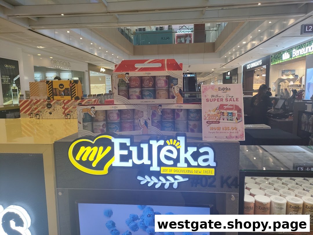 Eureka Popcorn kiosk in a mall, showcasing its illuminated logo, product displays, and a Mother's Day sale promotion.