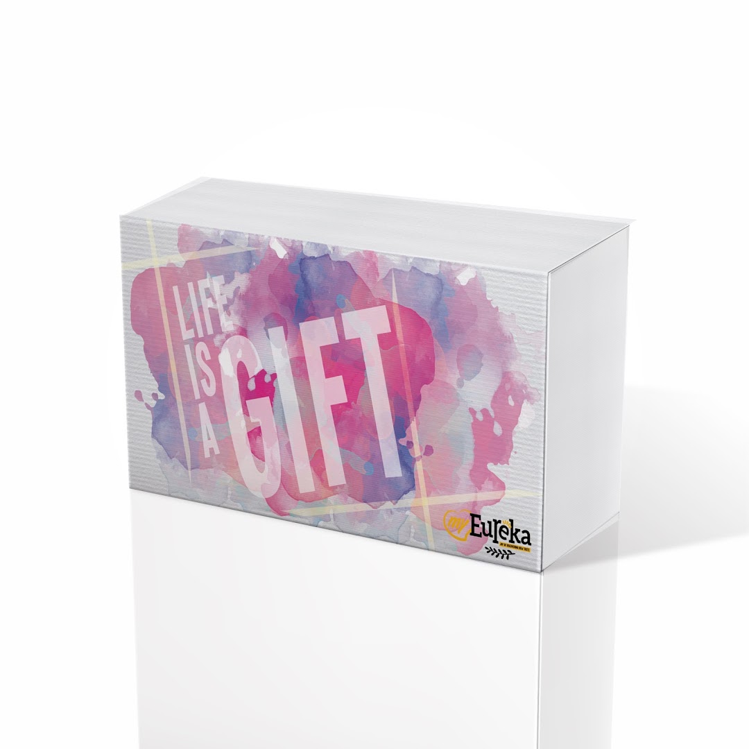 A white gift box featuring a colorful watercolor design and the text 'Life is a Gift' with the Eureka logo.