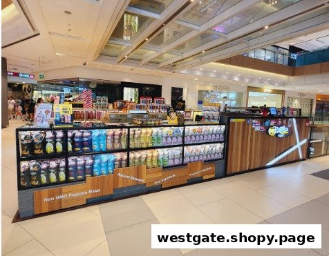 A vibrant Eureka Popcorn kiosk showcasing a wide array of packaged gourmet popcorn flavors.