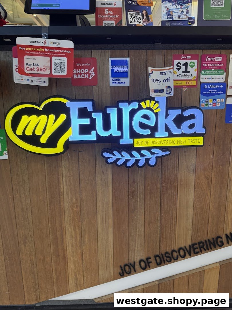 The Eureka Popcorn counter features its illuminated logo and various payment and loyalty program options.