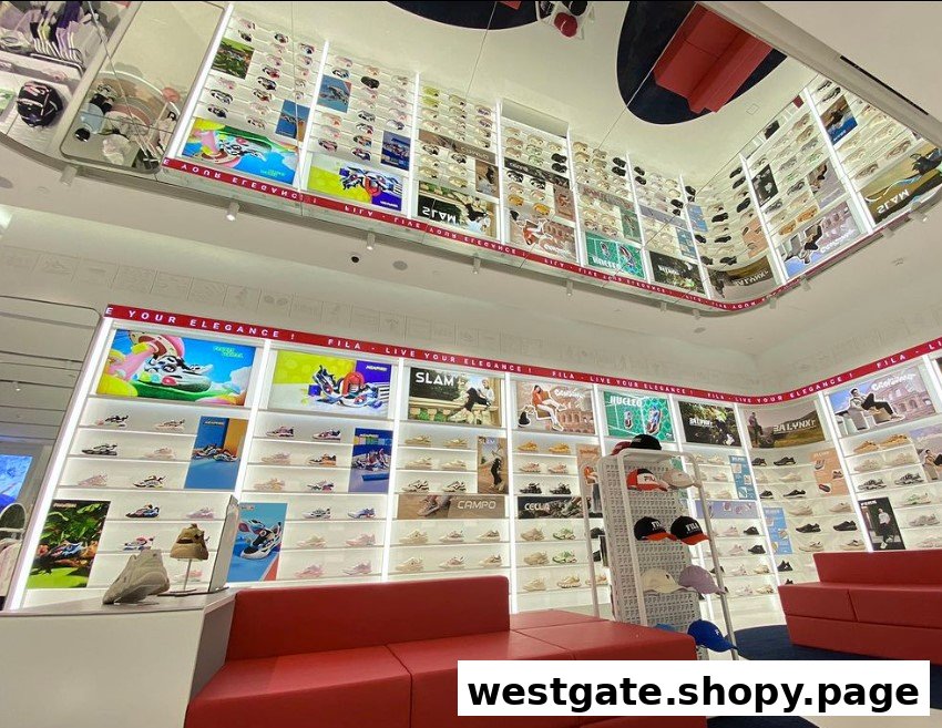 Interior view of FILA Westgate, showcasing numerous athletic shoes on display shelves and vibrant brand graphics.