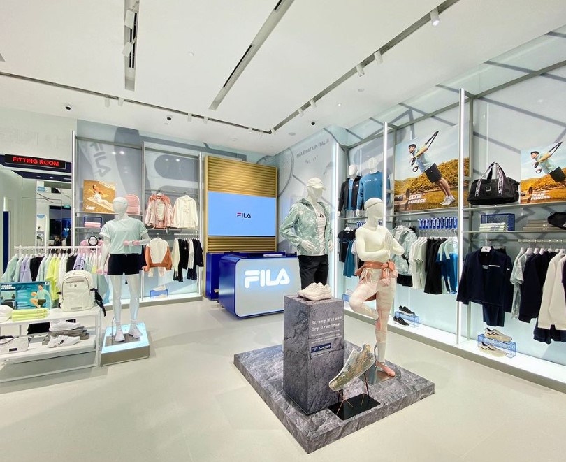 Interior view of FILA Westgate showcasing activewear, footwear, and accessories on mannequins and displays.