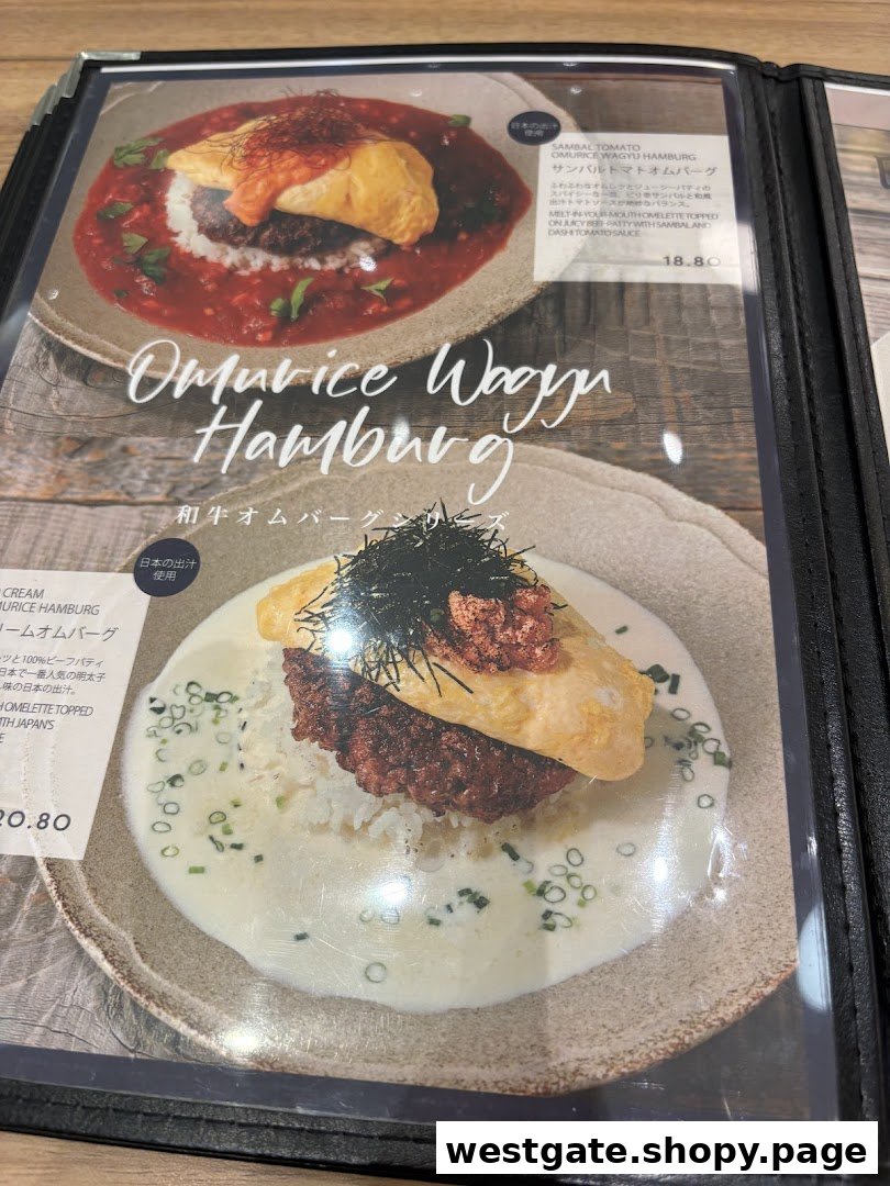 A close-up of a menu displaying two delicious Omurice Wagyu Hamburg dishes with prices and descriptions.