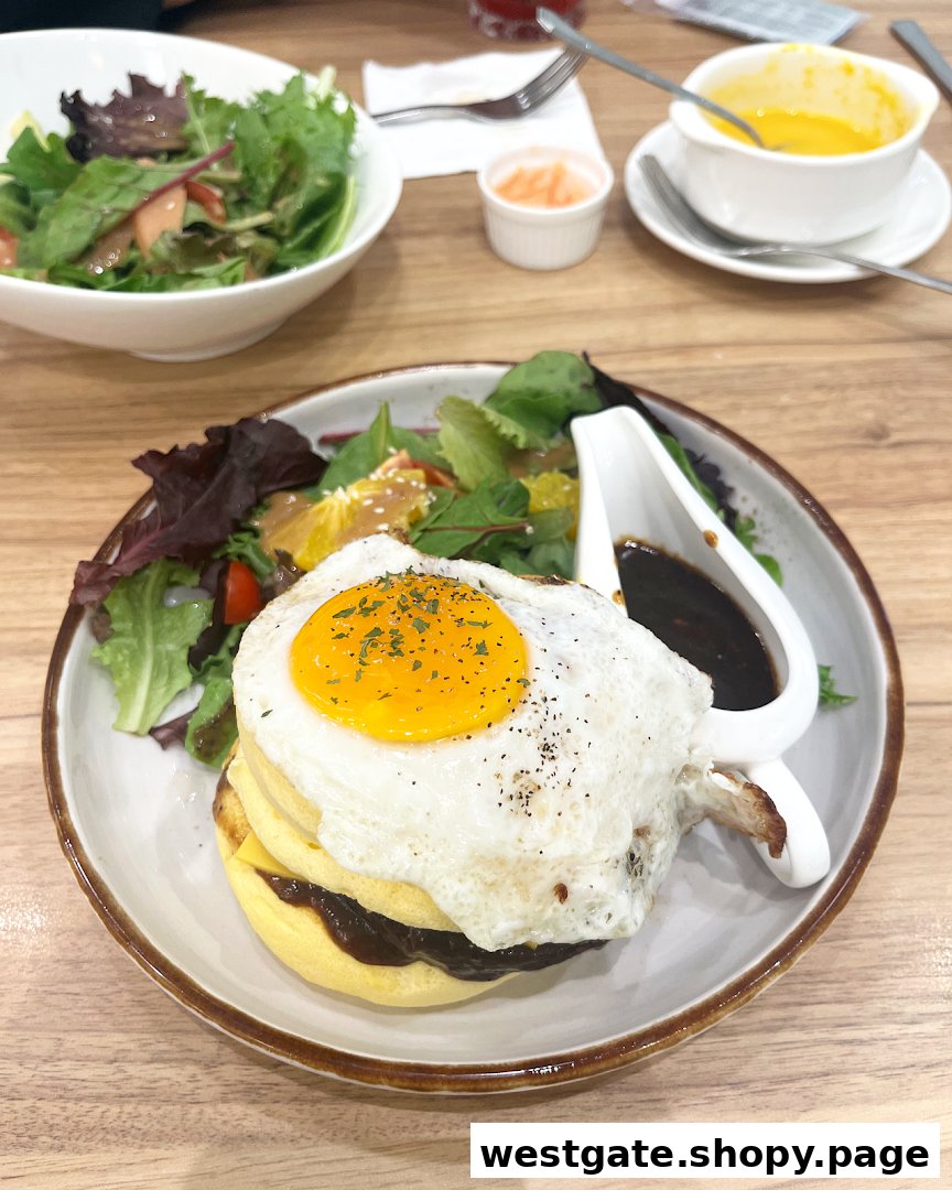 A delicious dish featuring a fried egg, pancakes, and a fresh side salad with gravy at Flippers Westgate.