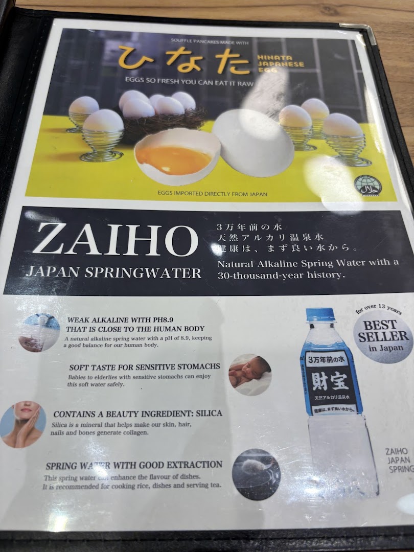 A menu page showcasing premium Hinata Japanese Eggs and Zaiho Japan Springwater.